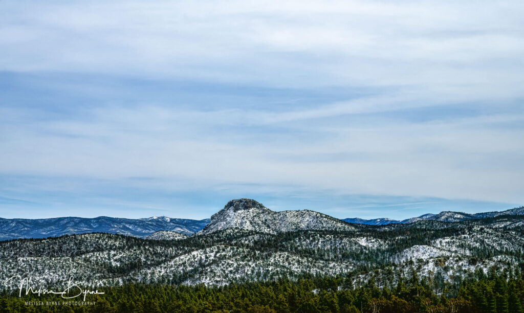 Snow covers Thumb Butte in Prescott, Arizona Image by Melissa Byrne Photography