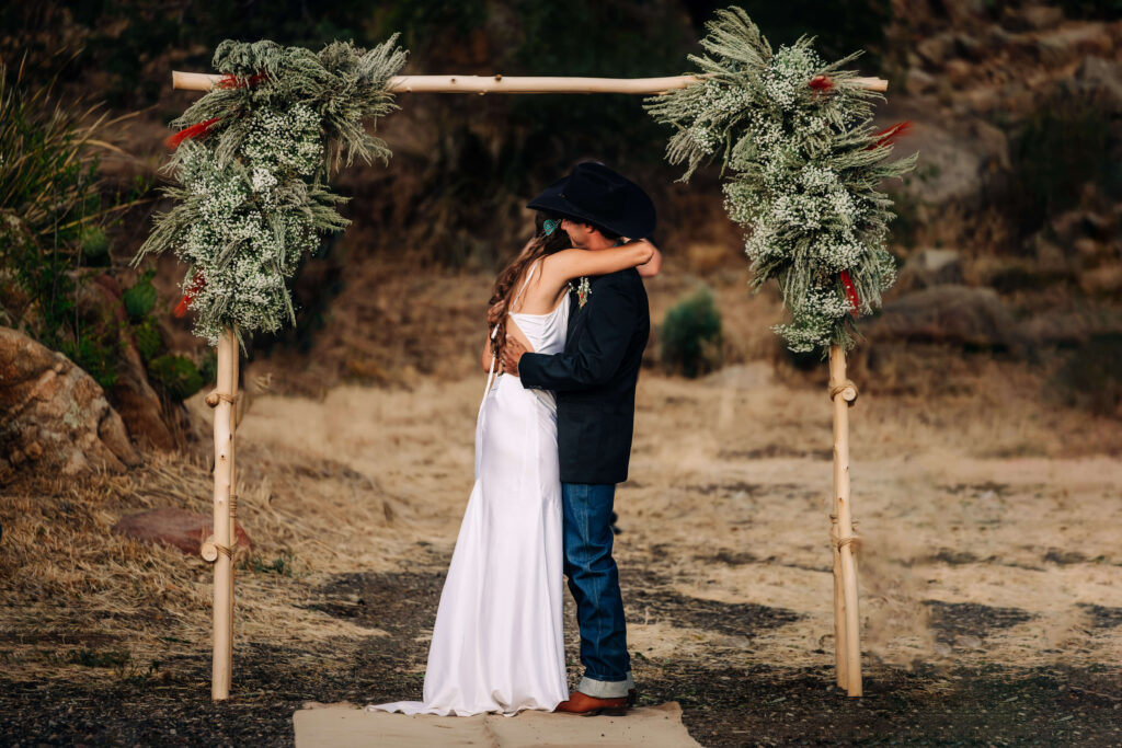 An outdoor location featuring bride and groom kissing by Prescott wedding photographer Melissa Byrne.