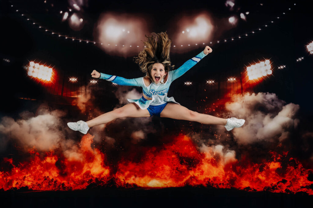 Competitive cheer near me sports portrait showing a cheerleader jumping in a split leap by Melissa Byrne Portrait Photography.